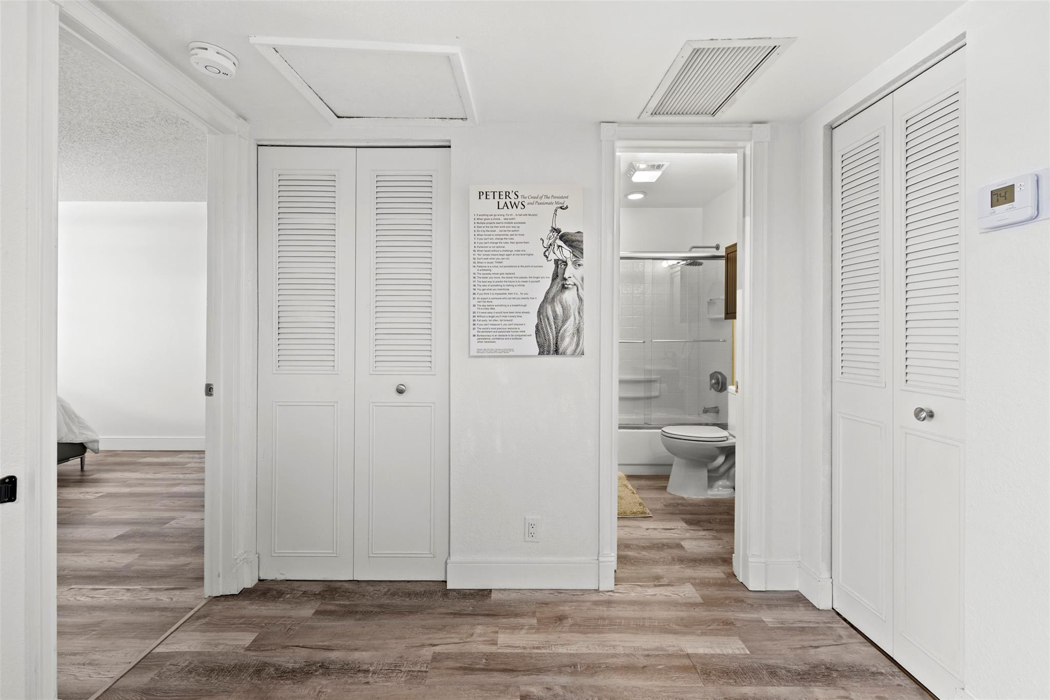 101 East McNab Road, Unit 219 Pompano Beach, FL 33060 - Photo 7 of 26 a view of a room with wooden floor and bathroom