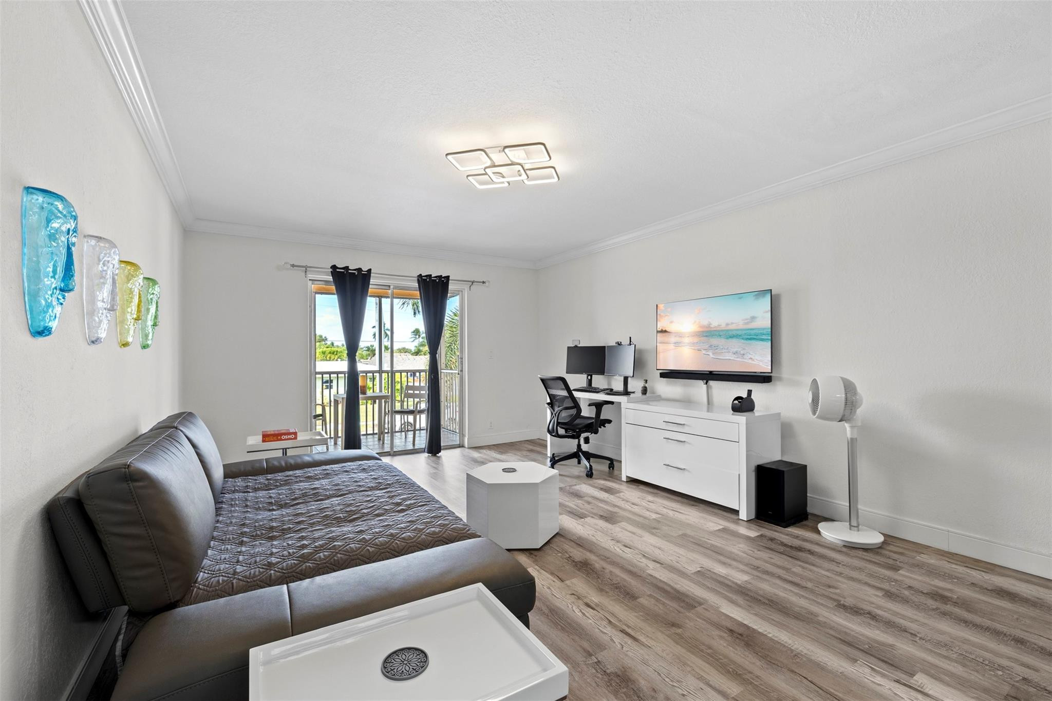 101 East McNab Road, Unit 219 Pompano Beach, FL 33060 - Photo 9 of 26 a living room with furniture and a flat screen tv