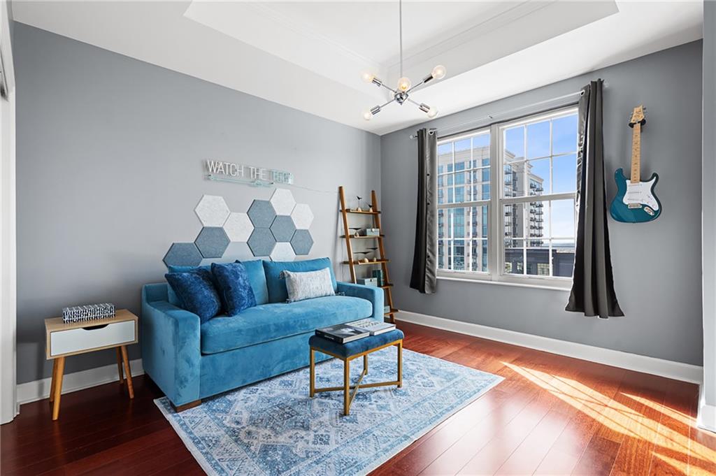325 East Paces Ferry Road Northeast, Unit 1711 Atlanta, GA 30305 - Photo 14 of 29 a living room with furniture and a large window