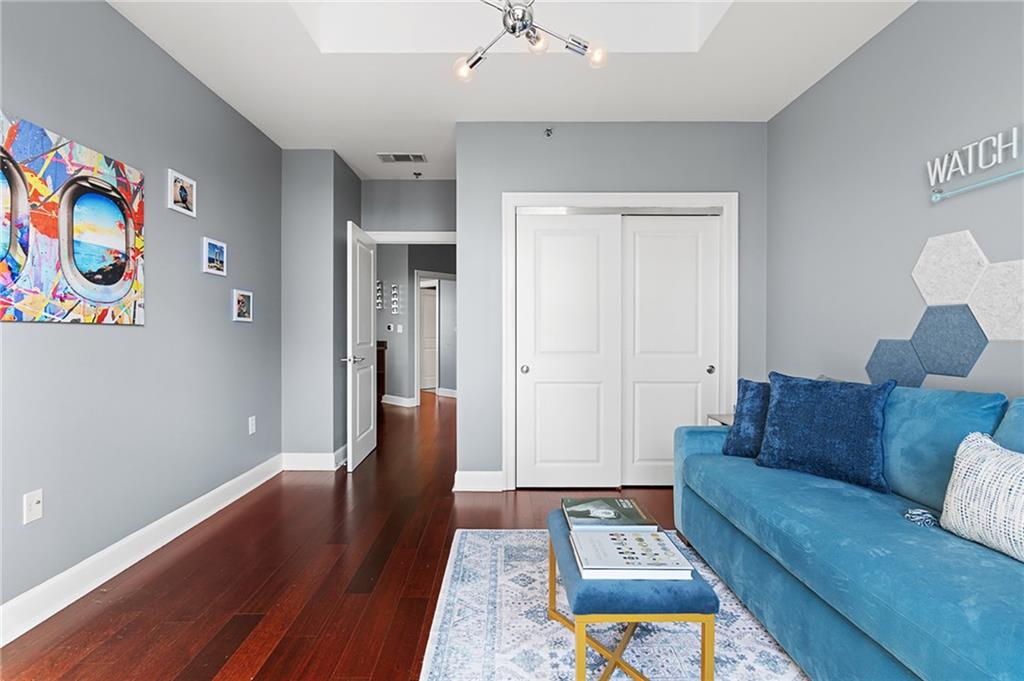 325 East Paces Ferry Road Northeast, Unit 1711 Atlanta, GA 30305 - Photo 15 of 29 a living room with furniture and a couch