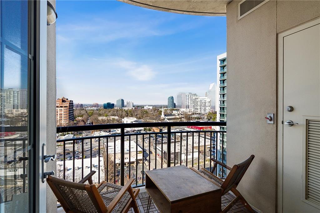 325 East Paces Ferry Road Northeast, Unit 1711 Atlanta, GA 30305 - Photo 16 of 29 a view of a balcony with city view