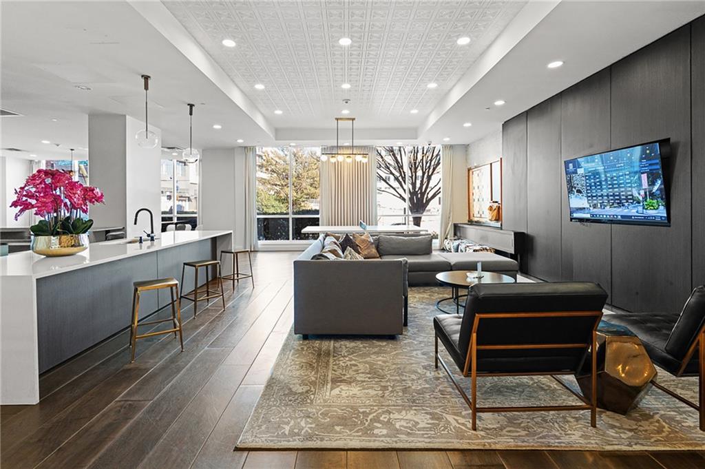 325 East Paces Ferry Road Northeast, Unit 1711 Atlanta, GA 30305 - Photo 20 of 29 a living room with furniture and a rug