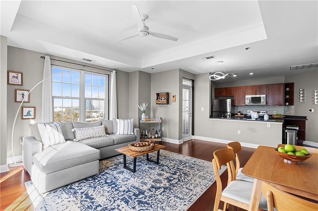 325 East Paces Ferry Road Northeast, Unit 1711 Atlanta, GA 30305 - Photo 2 of 29 a living room with furniture and a table