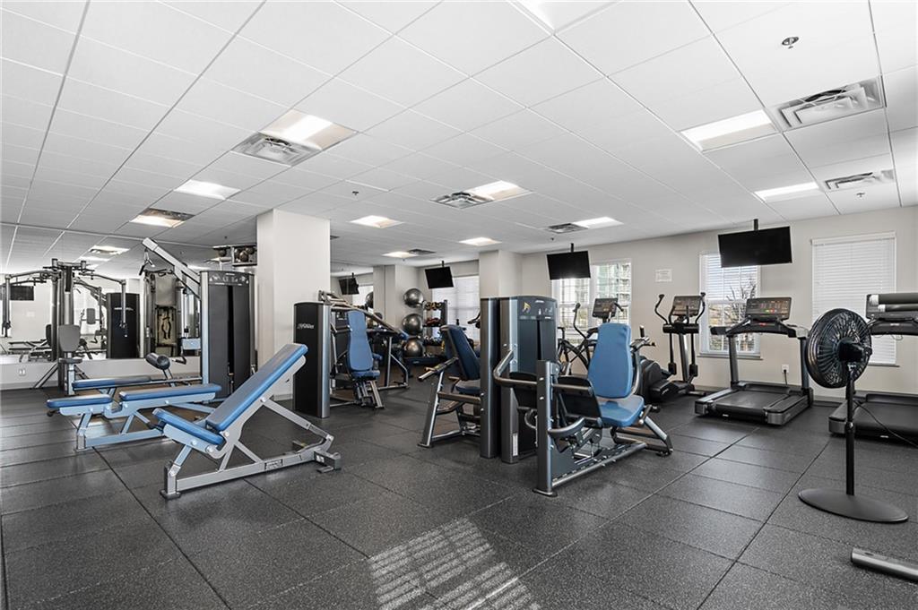325 East Paces Ferry Road Northeast, Unit 1711 Atlanta, GA 30305 - Photo 22 of 29 a view of a room with gym equipment