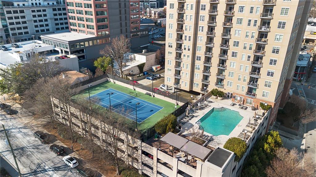 325 East Paces Ferry Road Northeast, Unit 1711 Atlanta, GA 30305 - Photo 29 of 29 a view of a chairs and table in a patio