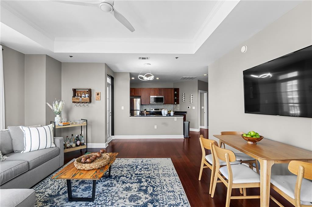 325 East Paces Ferry Road Northeast, Unit 1711 Atlanta, GA 30305 - Photo 4 of 29 a living room with furniture and wooden floor