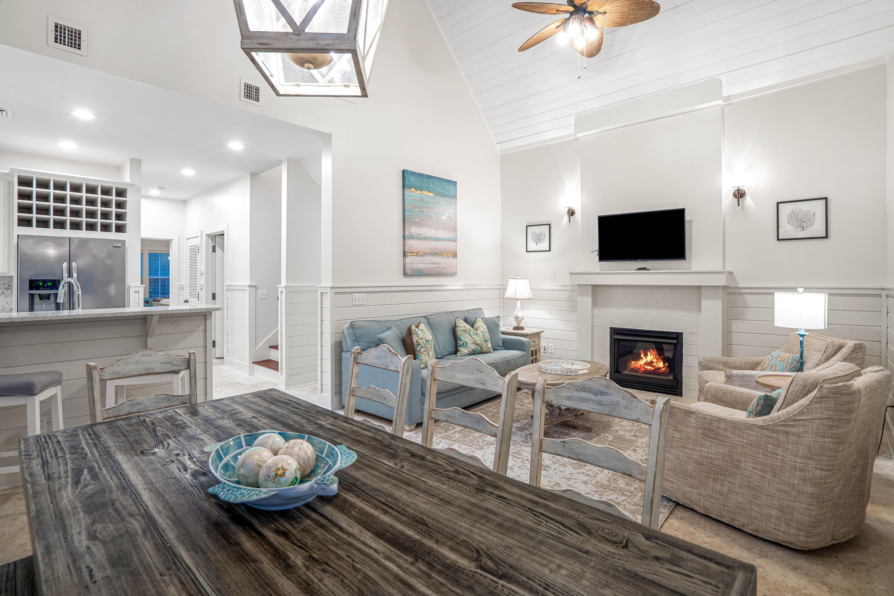 247 Salt Lane Watersound, FL 32461 - Photo 14 of 45 a living room with furniture a flat screen tv and a fireplace