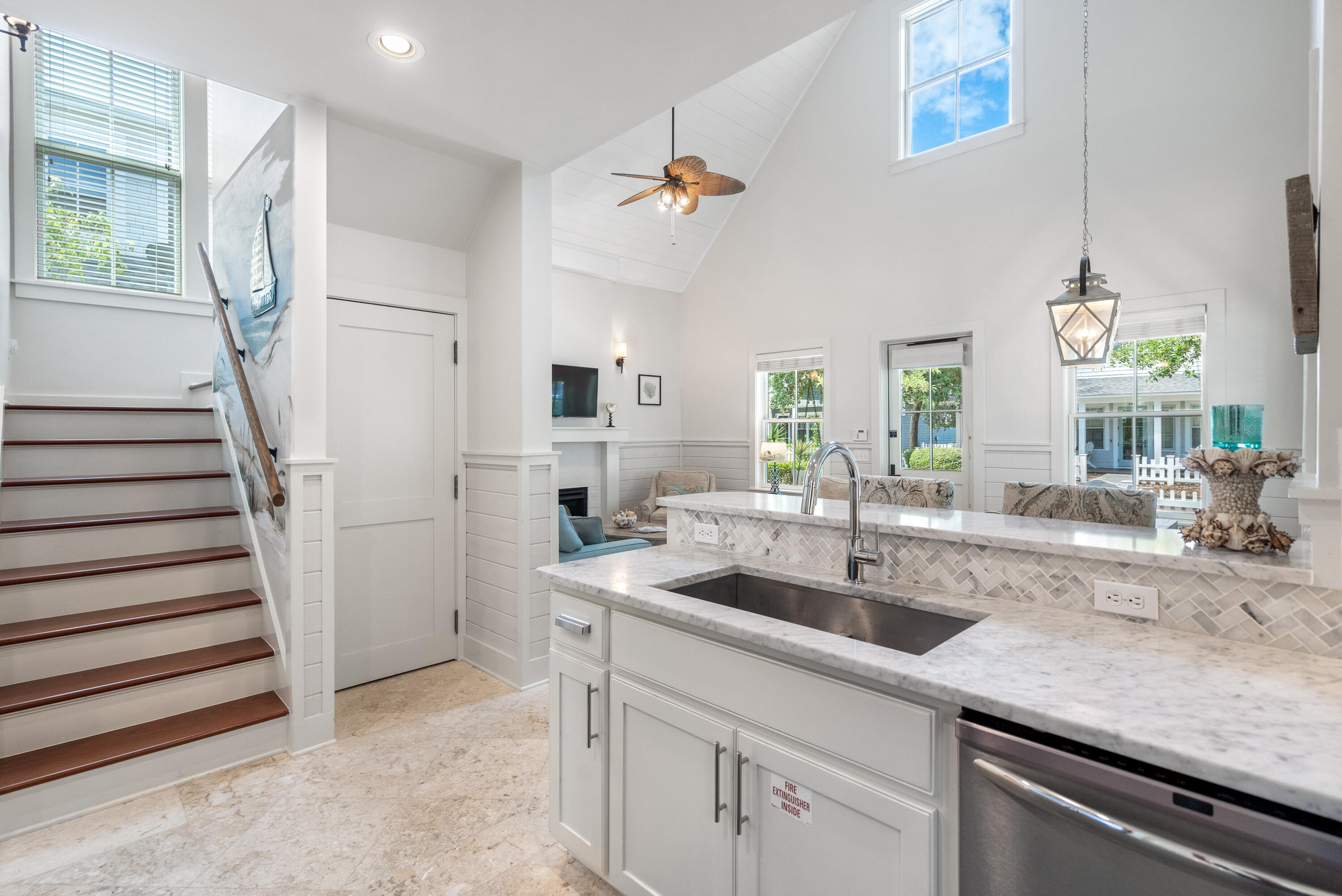 247 Salt Lane Watersound, FL 32461 - Photo 19 of 45 a kitchen with a sink and a refrigerator