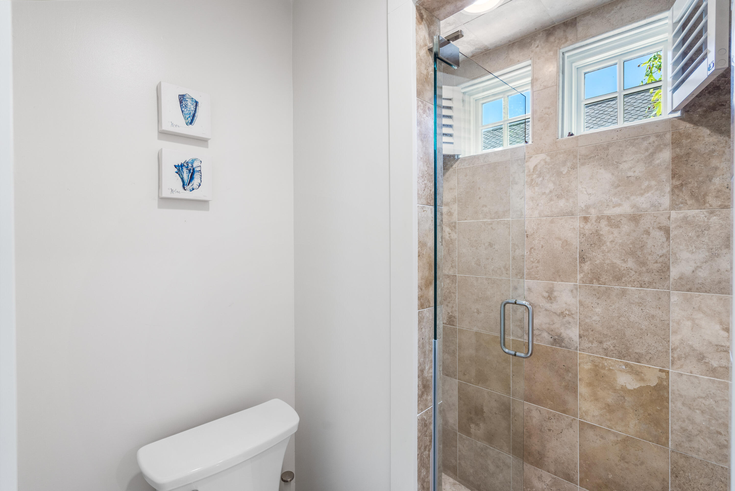 247 Salt Lane Watersound, FL 32461 - Photo 25 of 45 a white toilet sitting next to a bathroom sink