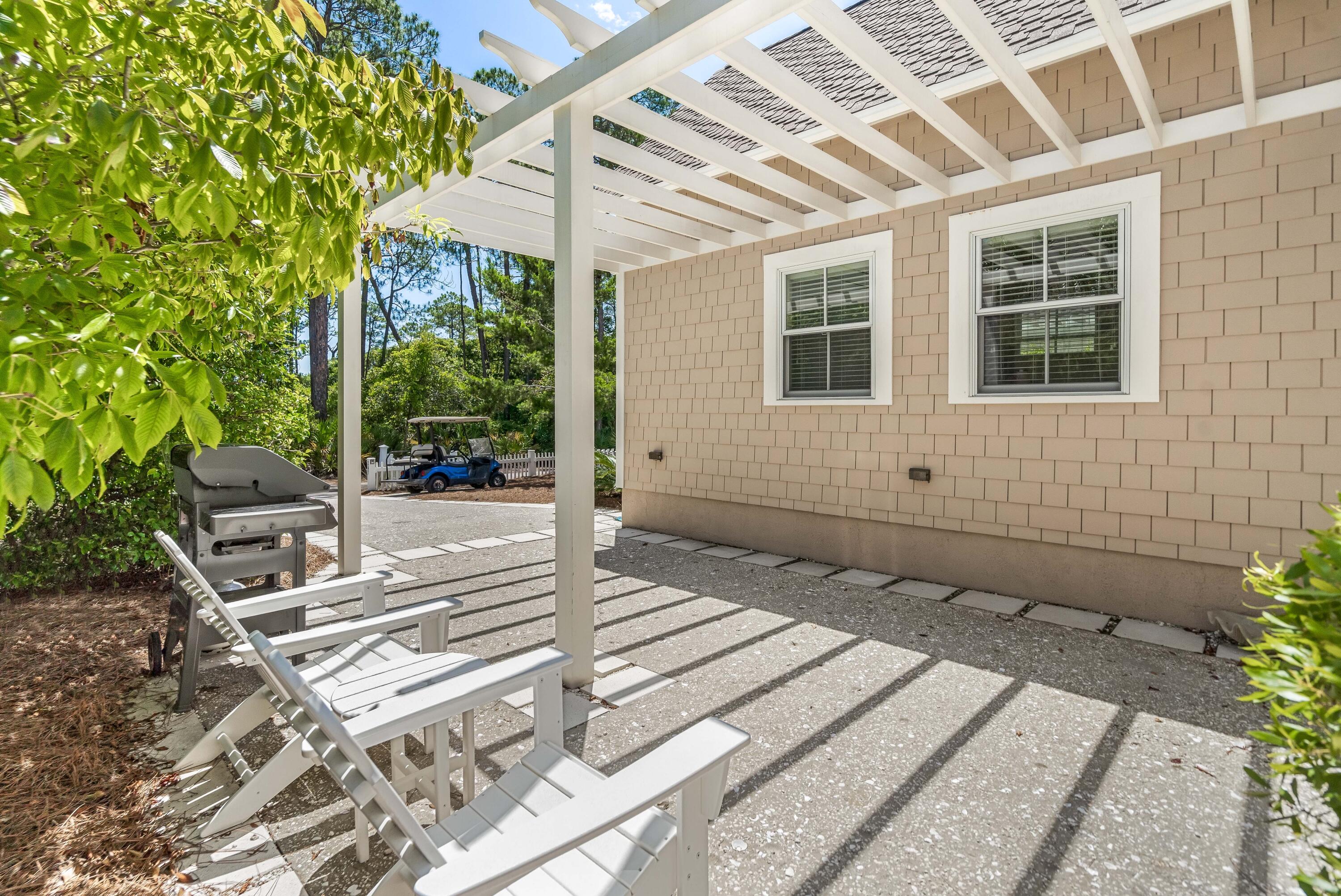 247 Salt Lane Watersound, FL 32461 - Photo 38 of 45 a front view of a house with garden