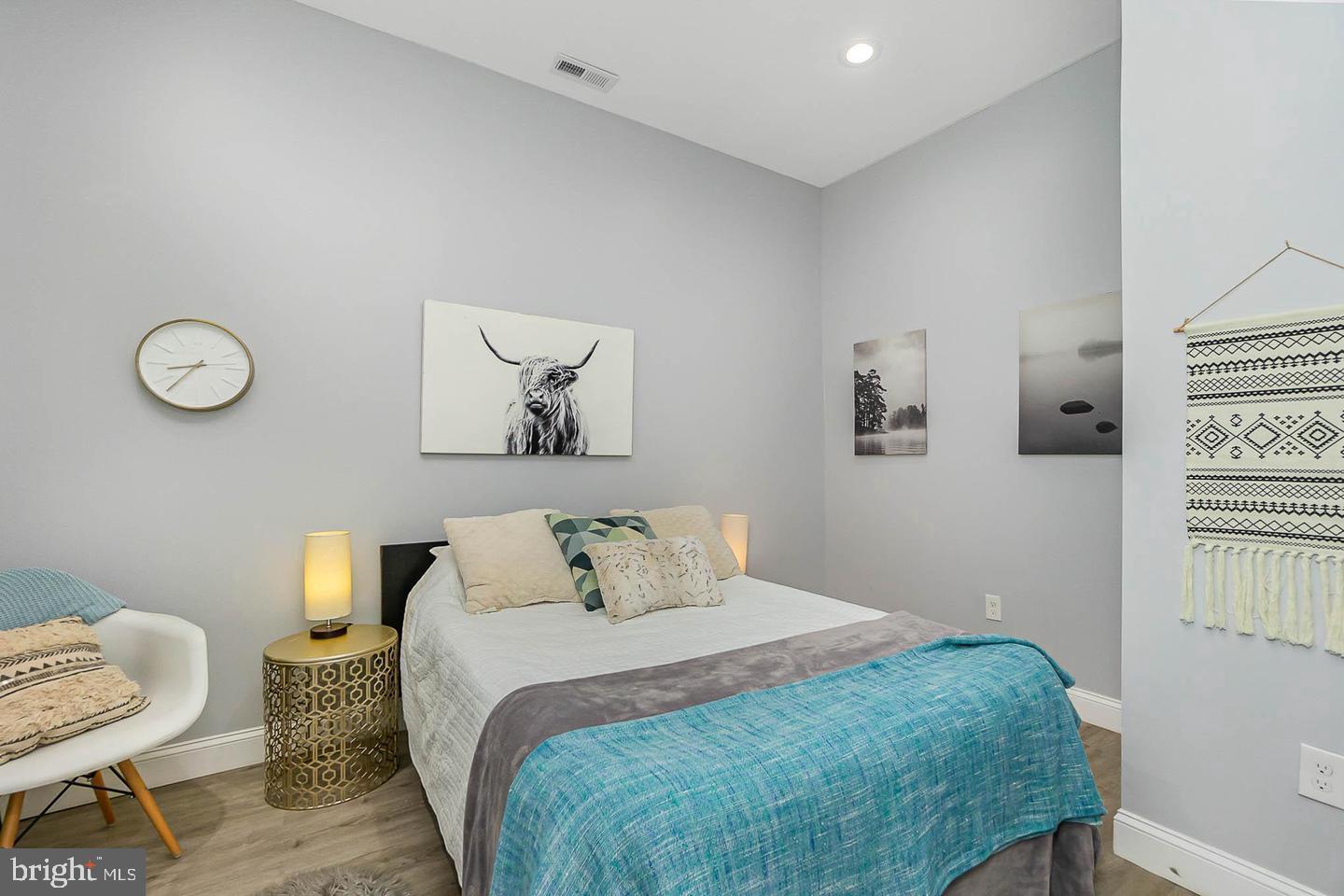 1709 Bank Street Baltimore, MD 21231 - Photo 6 of 49 a bedroom with a bed and lamp
