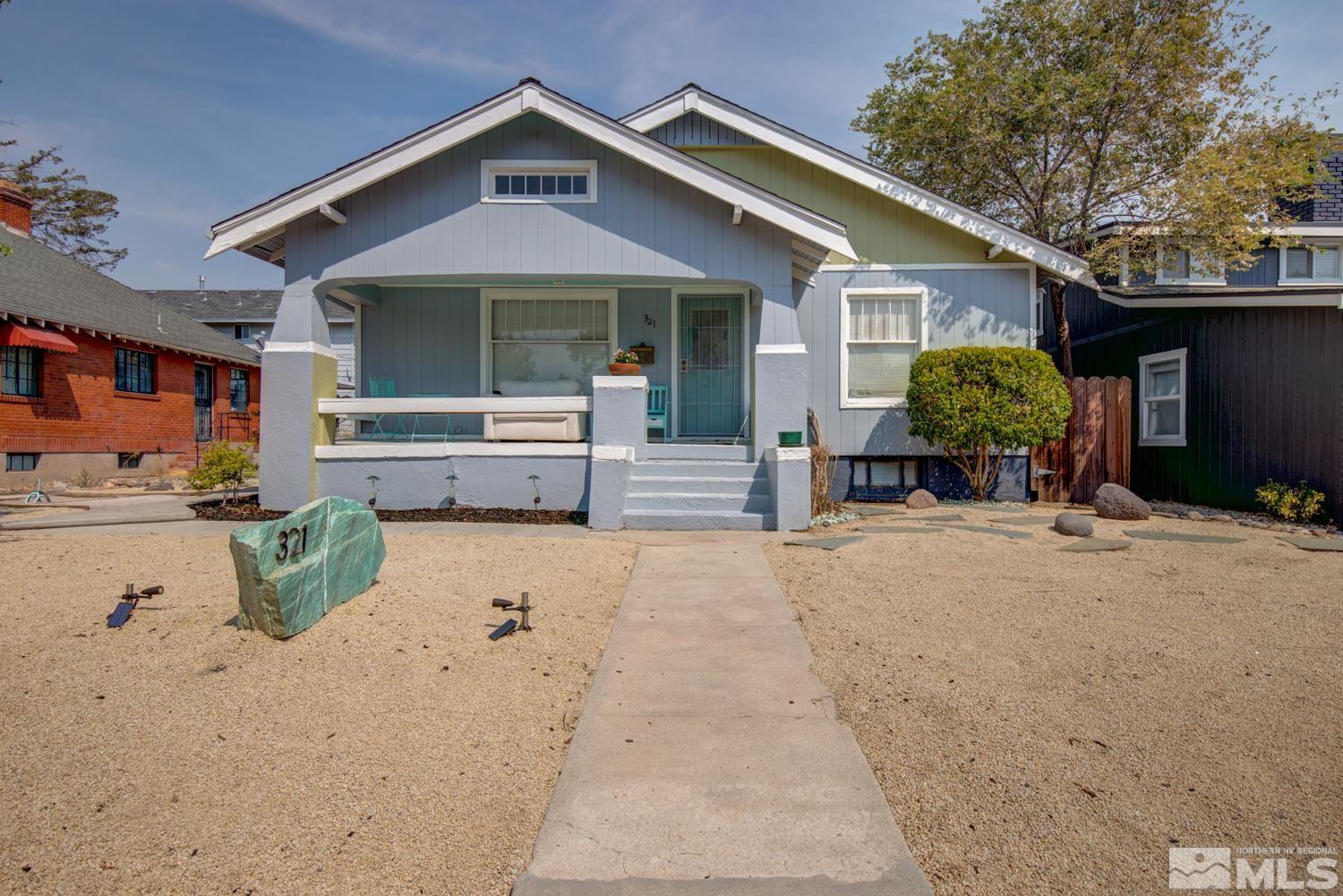 321 Crampton Street, Unit 1/2 Reno, NV 89502 - Photo 1 of 40 a front view of a house with a yard