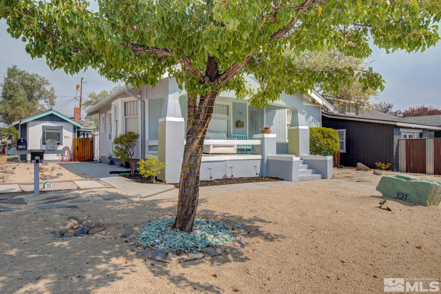 321 Crampton Street, Unit 1/2 Reno, NV 89502 - Photo 2 of 40 a front view of a house with a yard and garage