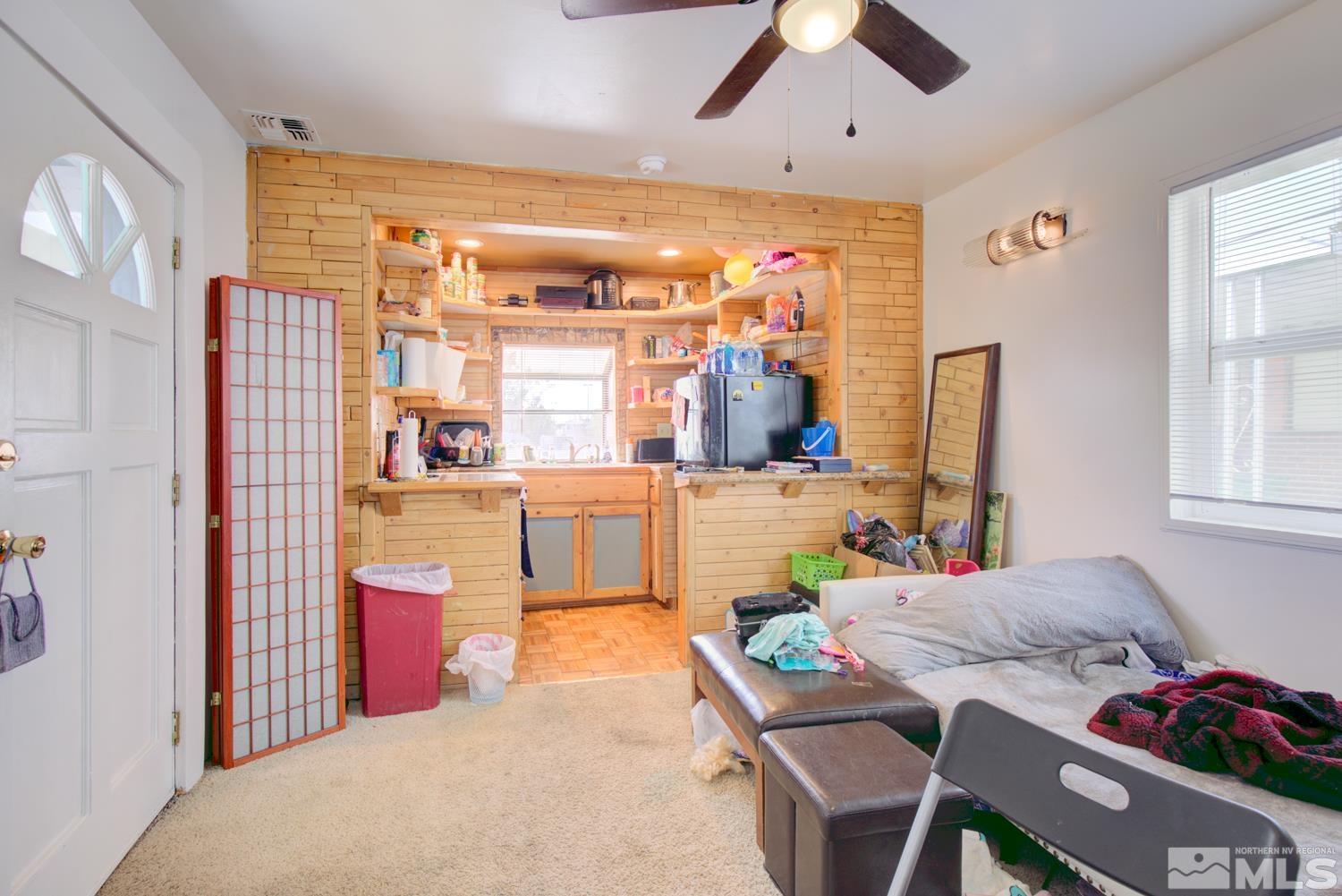 321 Crampton Street, Unit 1/2 Reno, NV 89502 - Photo 23 of 40 a bed room with furniture and a large window