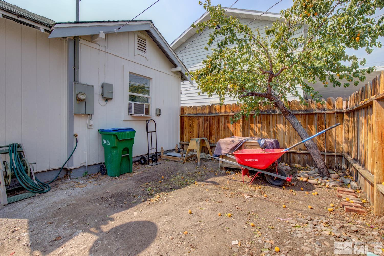 321 Crampton Street, Unit 1/2 Reno, NV 89502 - Photo 33 of 40 a view of a backyard with table and chairs potted plants