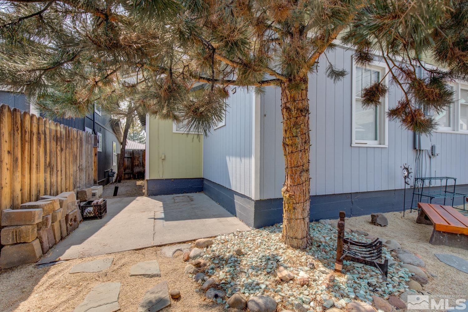 321 Crampton Street, Unit 1/2 Reno, NV 89502 - Photo 36 of 40 a backyard of a house with barbeque oven and outdoor seating