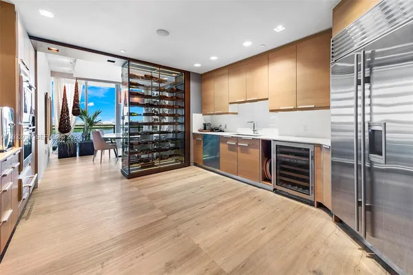 a kitchen with stainless steel appliances a stove and refrigerator