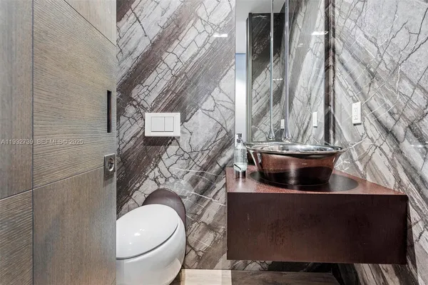 a view of a bathroom with a toilet and a sink
