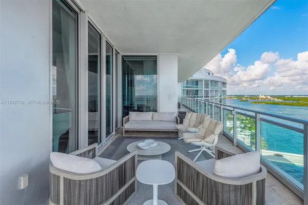 a balcony with furniture and garden view