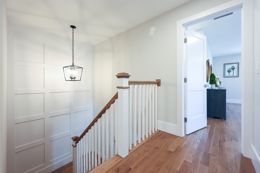55 Thomas Mann Circle, Unit 32 Norfolk, MA 02056 - Photo 13 of 31 a view of a hallway view with staircase