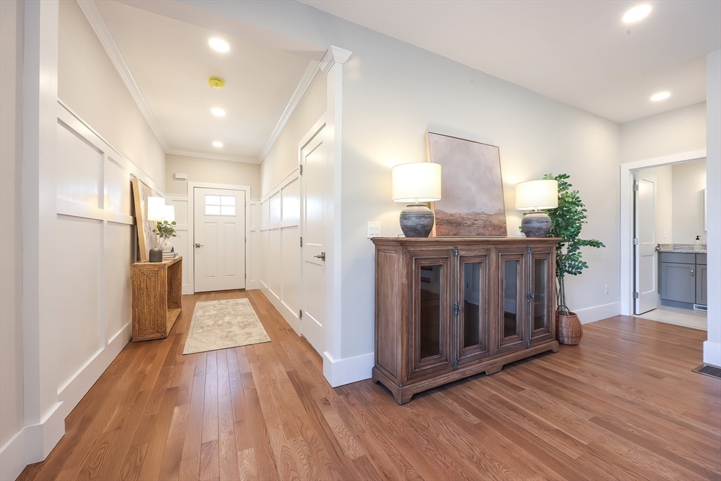 55 Thomas Mann Circle, Unit 32 Norfolk, MA 02056 - Photo 5 of 31 a view of a kitchen cabinets and wooden floor