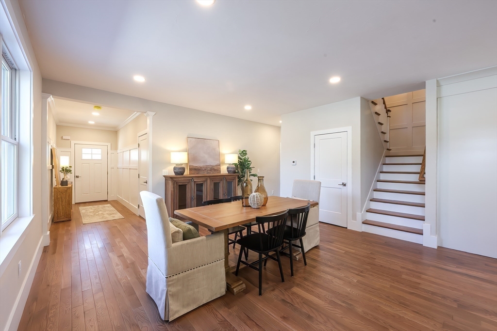 55 Thomas Mann Circle, Unit 32 Norfolk, MA 02056 - Photo 6 of 31 a dining room with furniture and wooden floor