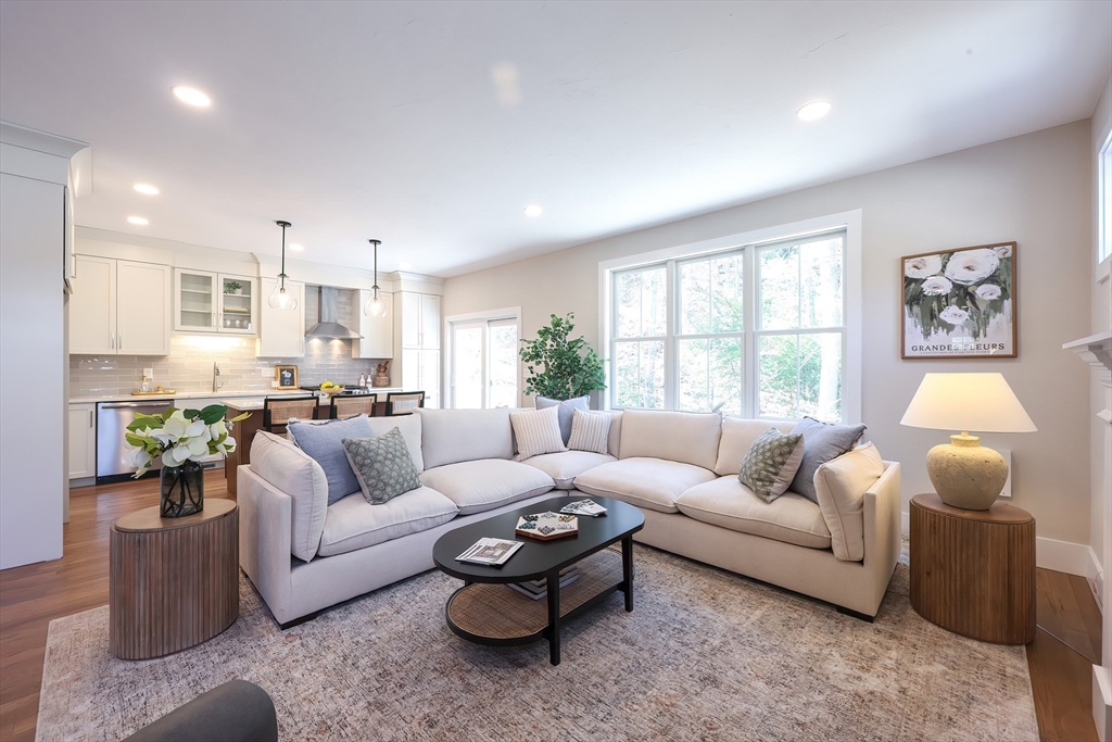 55 Thomas Mann Circle, Unit 32 Norfolk, MA 02056 - Photo 7 of 31 a living room with furniture and a window