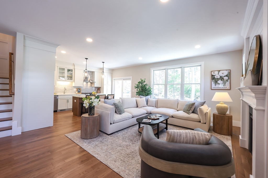 55 Thomas Mann Circle, Unit 32 Norfolk, MA 02056 - Photo 8 of 31 a living room with furniture and a large window