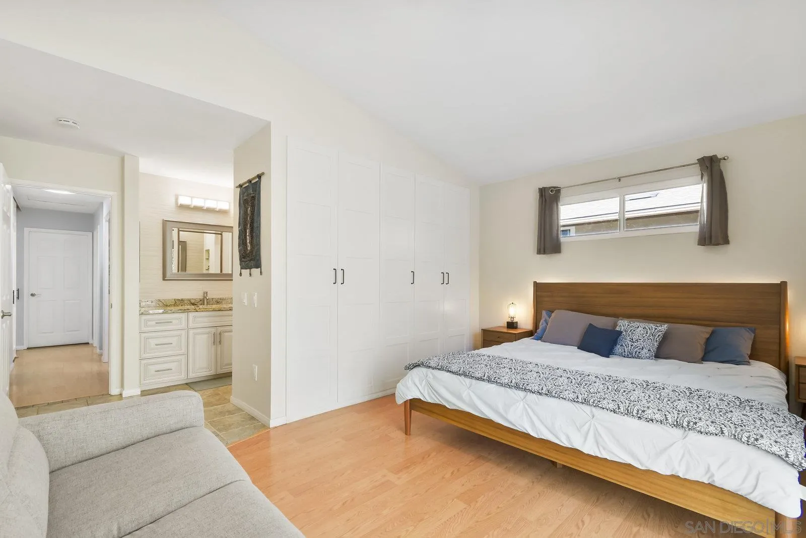12061 Rue Des Amis San Diego, CA 92131 - Photo 22 of 33 a bedroom with a large bed and ceiling fan