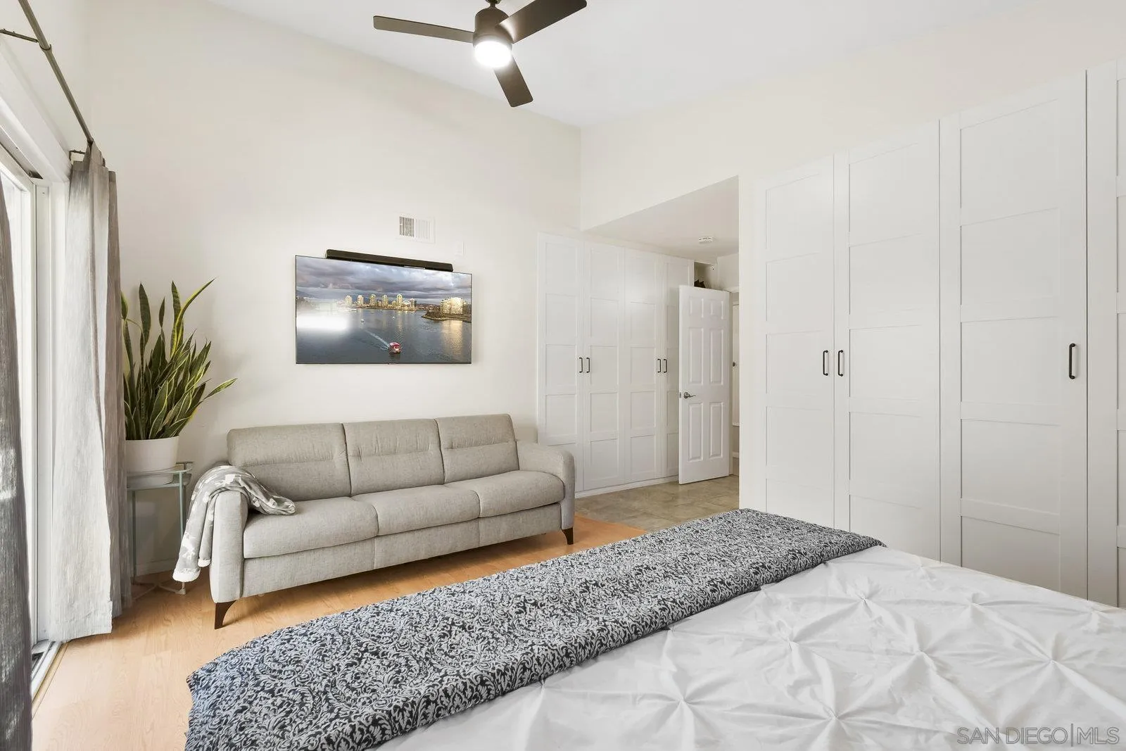 12061 Rue Des Amis San Diego, CA 92131 - Photo 23 of 33 a bedroom with a bed couches and a couch