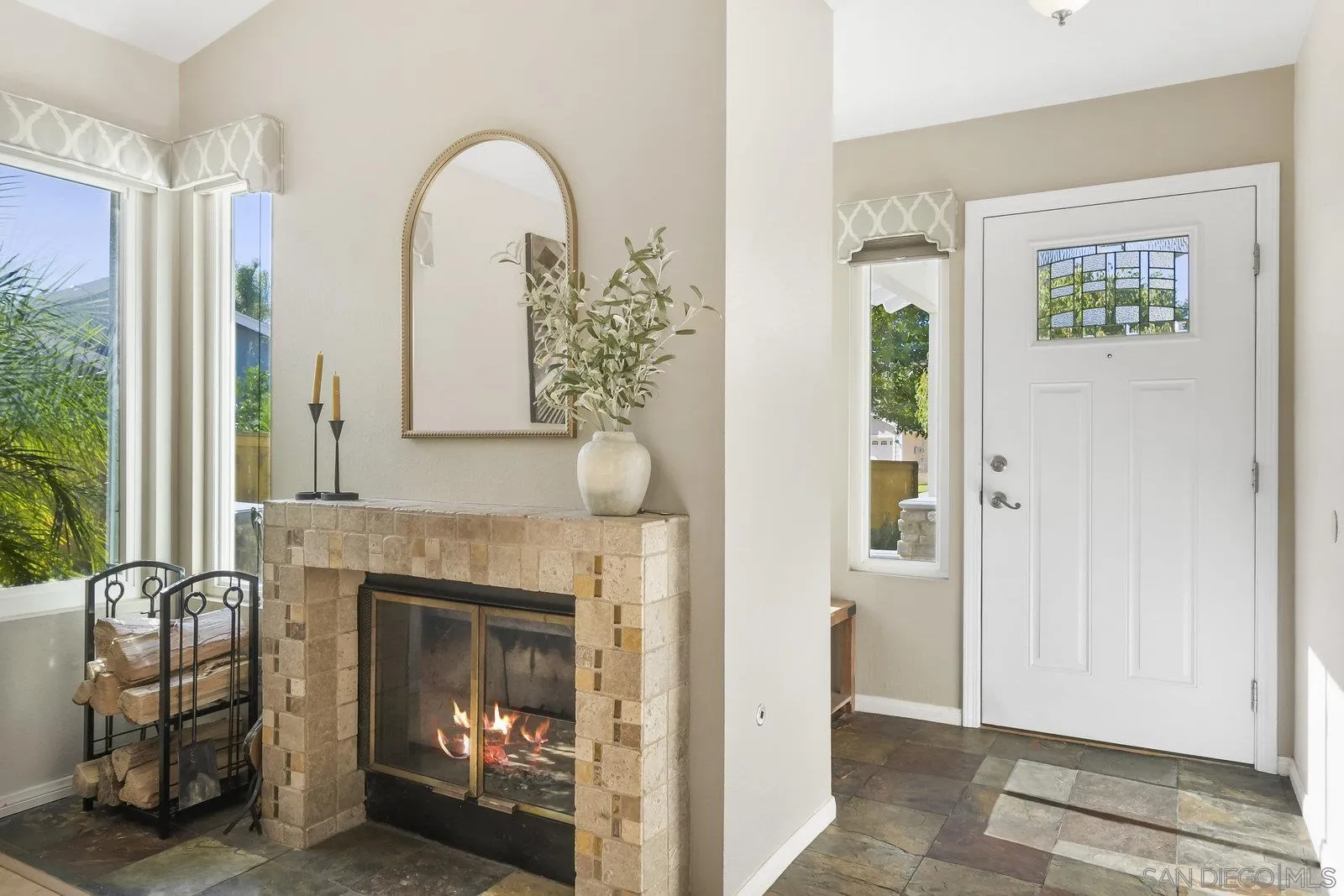 12061 Rue Des Amis San Diego, CA 92131 - Photo 8 of 33 a living room with furniture and a fireplace