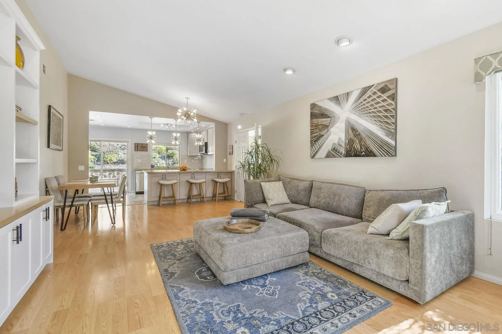 12061 Rue Des Amis San Diego, CA 92131 - Photo 9 of 33 a living room with furniture and a table