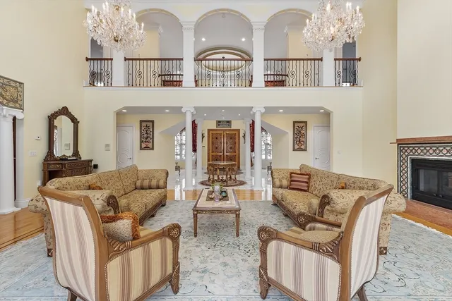 a living room with furniture and fireplace