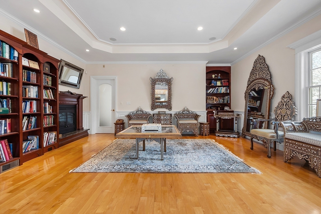 30 Bridle Path Shrewsbury, MA 01545 - Photo 22 of 41 a living room with furniture and a book shelf