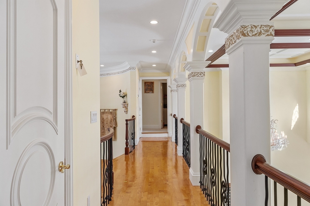 30 Bridle Path Shrewsbury, MA 01545 - Photo 30 of 41 a view of a hallway with wooden floor and staircase