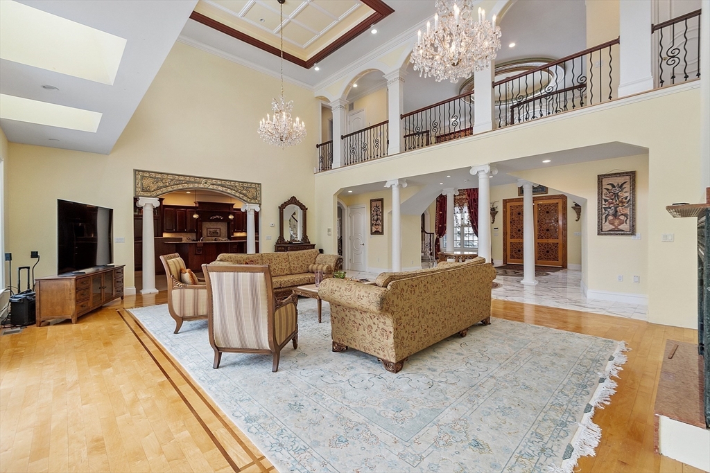 30 Bridle Path Shrewsbury, MA 01545 - Photo 6 of 41 a living room with furniture a flat screen tv and kitchen view
