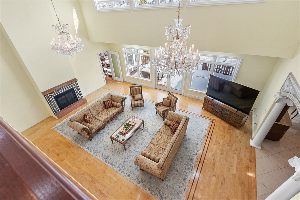 30 Bridle Path Shrewsbury, MA 01545 - Photo 7 of 41 a view of a dining room with furniture a chandelier and wooden floor
