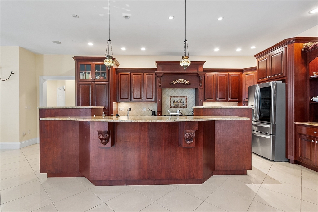 30 Bridle Path Shrewsbury, MA 01545 - Photo 10 of 41 a kitchen with stainless steel appliances granite countertop a refrigerator a sink and a stove
