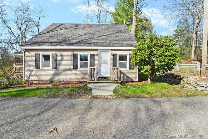 35 Philo Curtis Road Newtown, CT 06482 - Photo 1 of 1 a front view of house with yard and trees