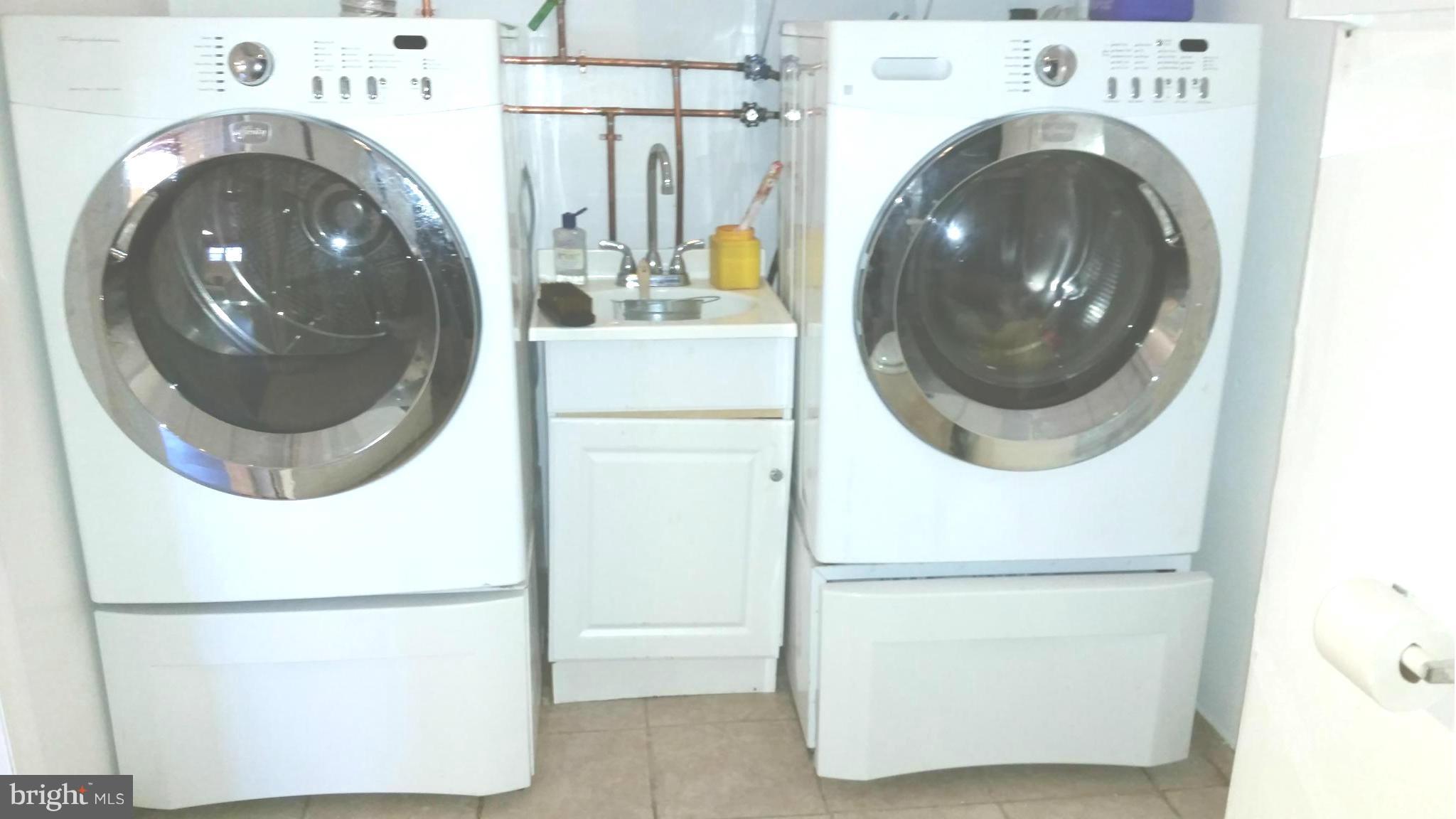 7510 Saffron Court Hanover, MD 21076 - Photo 21 of 30 a utility room with dryer and washer
