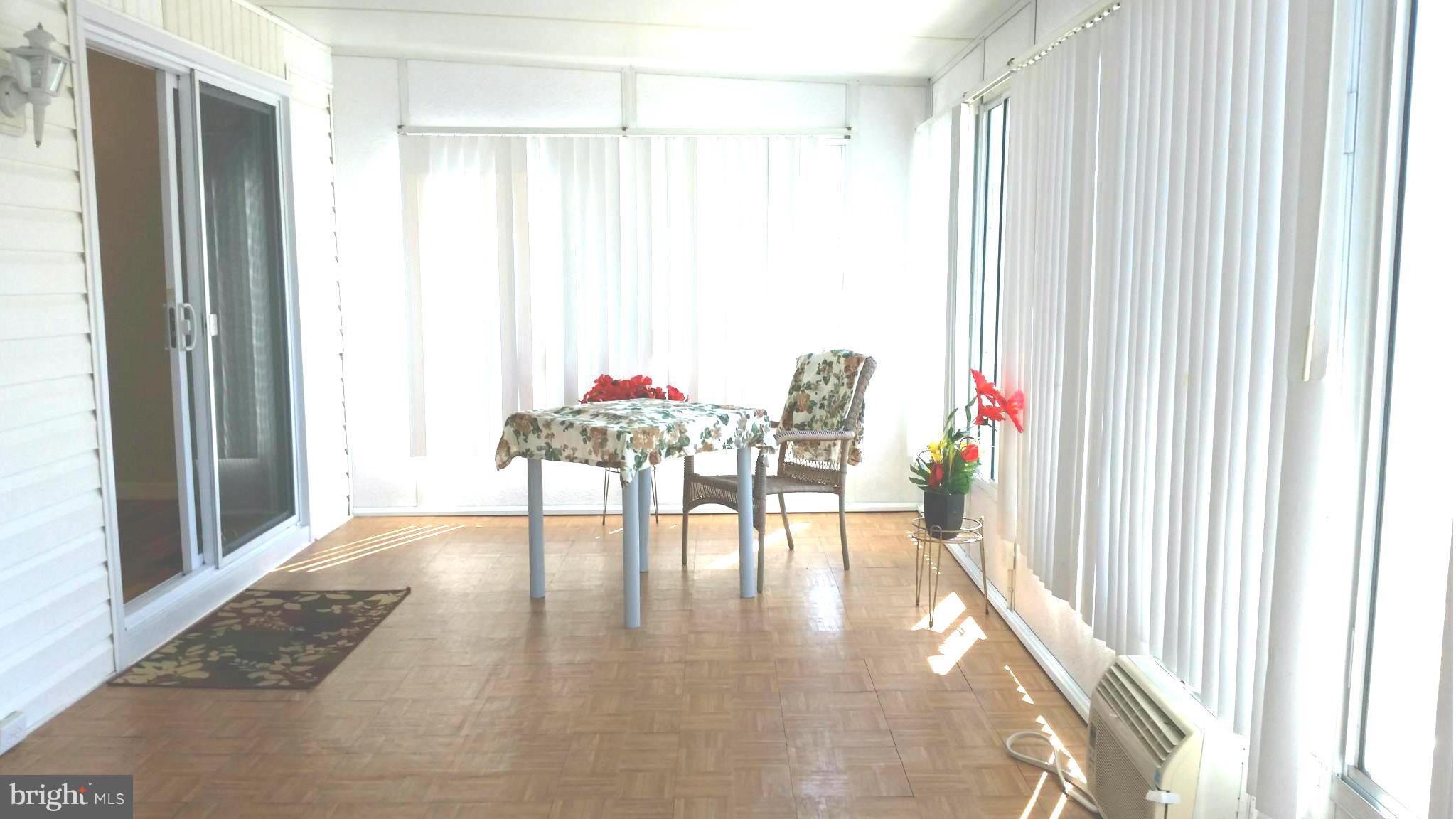 7510 Saffron Court Hanover, MD 21076 - Photo 23 of 30 a view of dining room with hardwood floor and living room