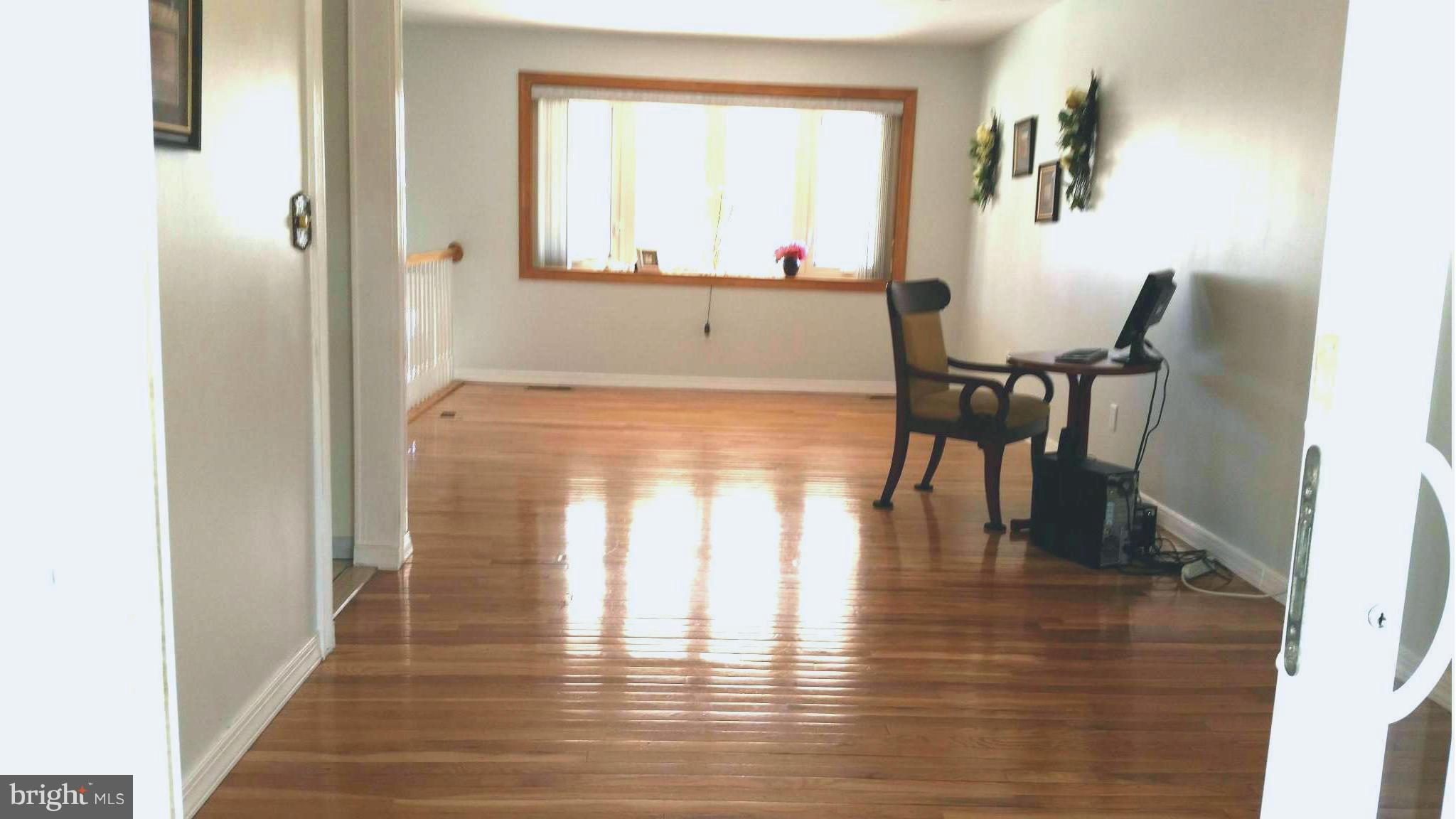 7510 Saffron Court Hanover, MD 21076 - Photo 5 of 30 a view of dining room with furniture and wooden floor