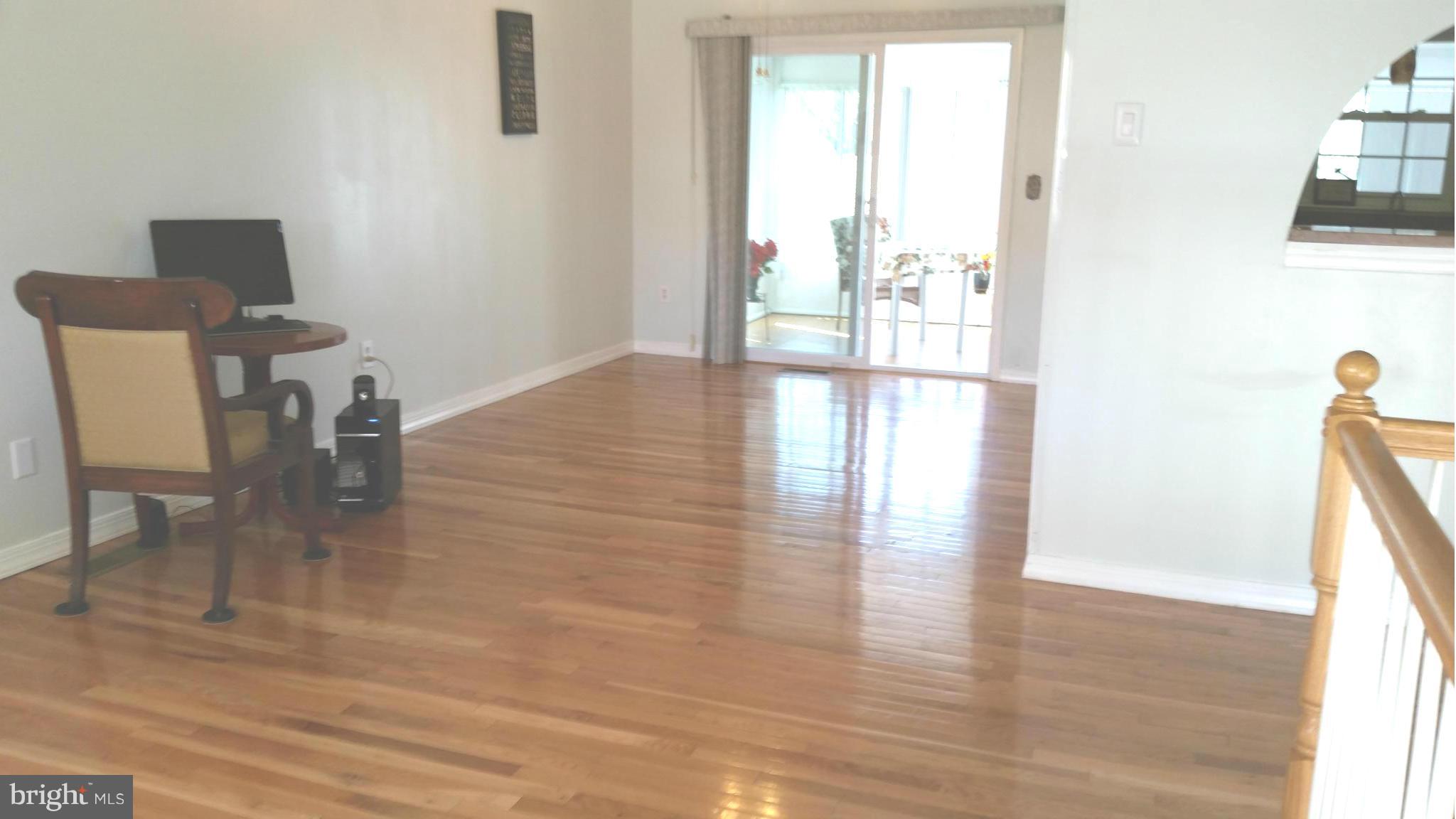 7510 Saffron Court Hanover, MD 21076 - Photo 7 of 30 a view of a room with wooden floor and a window