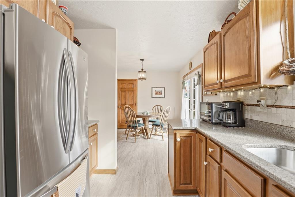695 Greenhouse Road Rockwood, PA 15557 - Photo 16 of 50 a kitchen with stainless steel appliances granite countertop a refrigerator and a sink