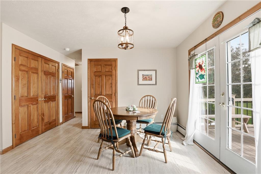 695 Greenhouse Road Rockwood, PA 15557 - Photo 17 of 50 a view of a dining room with furniture window and wooden floor