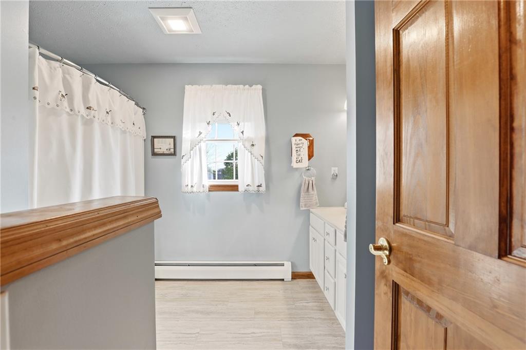 695 Greenhouse Road Rockwood, PA 15557 - Photo 21 of 50 a view of a kitchen with wooden floor and a large window
