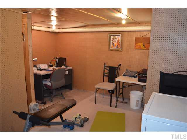3507 Mill Run Raleigh, NC 27612 - Photo 16 of 16 a view of a workspace with furniture