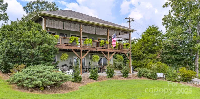 front view of a house with a tree in a yard