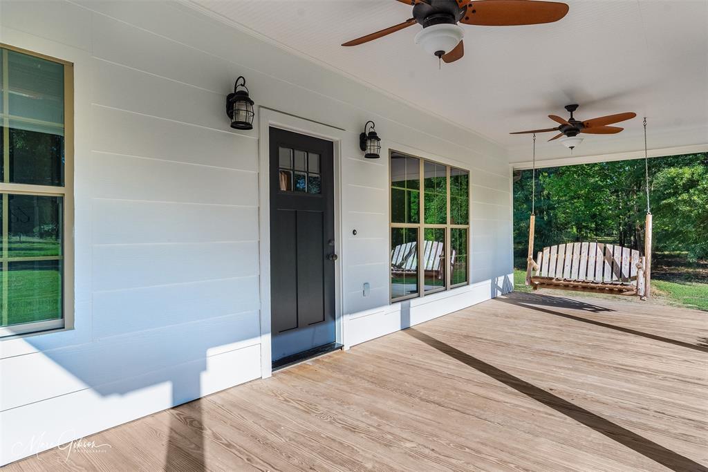 550 Linton Bellevue Road Benton, LA 71006 - Photo 8 of 37 View of front porch with porch swing