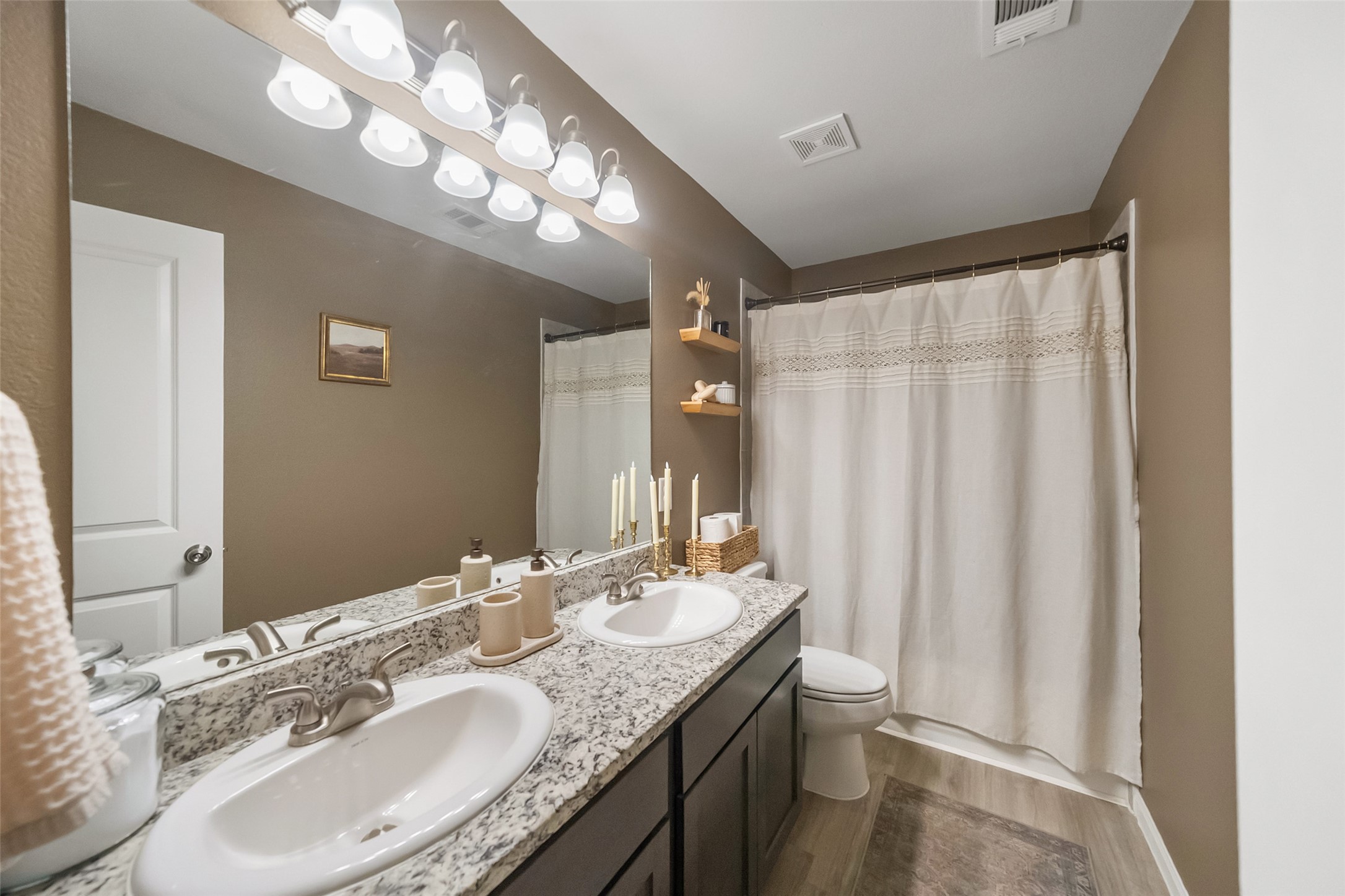 26431 Pin Oak Drive Hempstead, TX 77445 - Photo 17 of 31 a bathroom with a granite countertop sink a toilet and a mirror